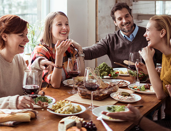 A family enjoys a holiday meal together with IBS-C and CIC-friendly foods.  