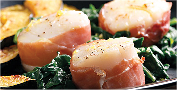 Delicious Low FODMAP Prosciutto Wrapped Scallops with Spinach.